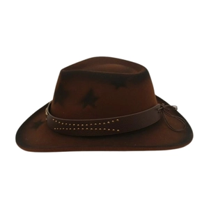 Detail of vintage brown cowboy hat featuring metal studs and star pattern on wool felt