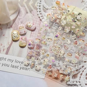 Macro detail of 3D embossed nail art stickers with cute cat and dessert patterns