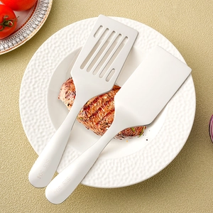 SUS 304 stainless steel spatula set for steak and teppanyaki on a white plate