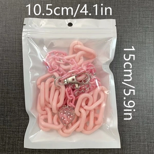 Pink acrylic pants chain with cute strawberry charm and size labels 10.5cm by 15cm