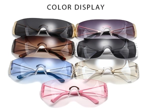 Close-up of frameless Y2K sunglasses with rhinestone details in multiple colors