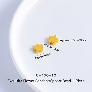Macro shot of 6mm gold plated five-petal flower spacer beads for DIY jewelry making