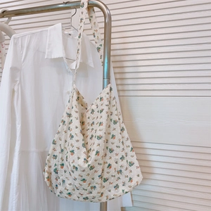 Close-up of floral cotton tote bag with jacquard dots and blue orange flower print