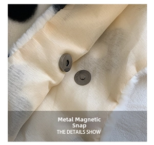 Detail of silver magnetic buckle on floral plush handbag with faux fur texture