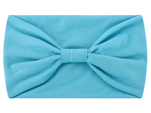 Detail view of sky blue knotted wide headband showing soft knitted fabric texture