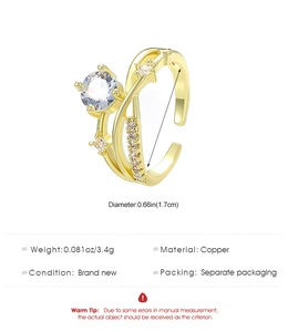 Detailed view of golden multi-layer crisscross ring with cubic zirconia stones