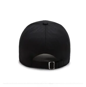 Detail of adjustable metal buckle on black baseball cap for men with cotton fabric texture