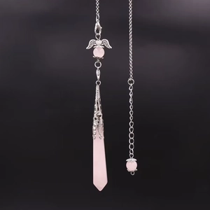 Detail of rose quartz hexagonal pendant with silver angel wings and metallic chain