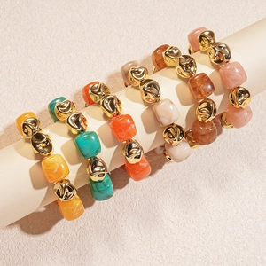 Irregular acrylic resin beaded necklace with gold metal accents in various colors