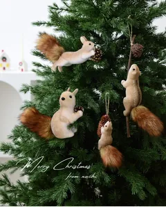 Detailed view of plush Christmas tree squirrel ornaments with bushy tails and pinecones