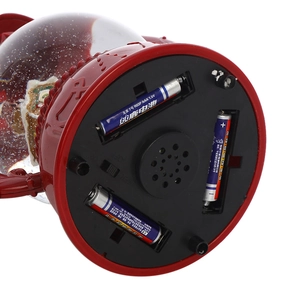 Detailed base view of Christmas snow globe lantern showing battery box and speaker