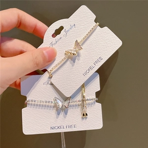 Elegant butterfly bracelet with shell texture and crystals in gold and silver finish