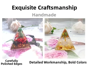 Detailed macro view of two handmade orgone crystal pyramids with miniature trees