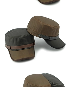 Close-up of canvas cadet caps with synthetic leather bands and metallic button details