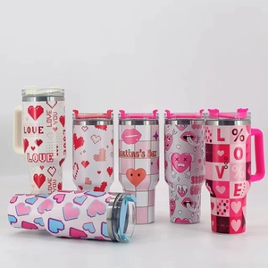 Detailed view of six 40oz insulated tumblers with Valentine's pixel hearts and love patterns