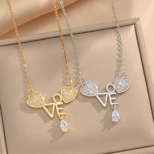 Gold and silver heart necklaces with LOVE letters and pear-shaped rhinestones