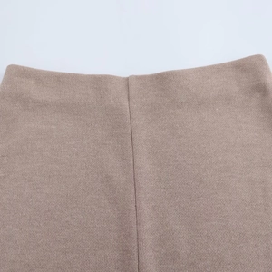Close-up of brown knit midi skirt set showing tight texture and precise stitching details
