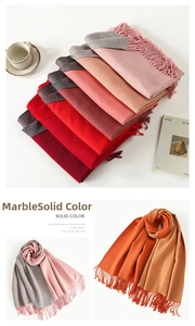 Detail of warm winter scarf collection with elegant fringe and soft solid colors