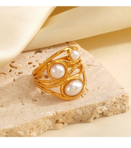 Detailed view of 18K gold plated hammered ring with three elegant inlaid pearls
