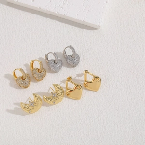 Chic heart and moon earrings set with zircon stones in gold and silver finishes