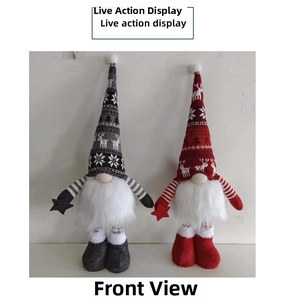 Close-up of luminous Christmas gnomes with knit reindeer hats and long legs