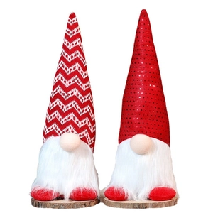 Christmas gnomes with red sequins and wooden base for holiday tabletop decoration