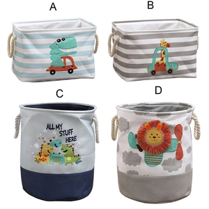 Detail showing four cartoon storage baskets with dinosaur and lion prints and rope handles