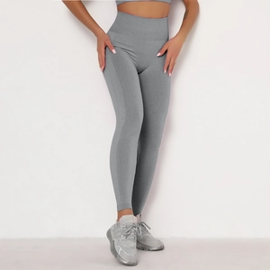 Close-up of seamless gray yoga leggings showing high-waist fit and knit texture