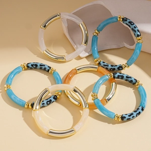 Three-piece set of acrylic dyed round elastic bracelets with gold metal beads