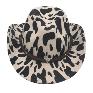 Cow print felt western cowboy hat with brown leather band and metal bull head accessory