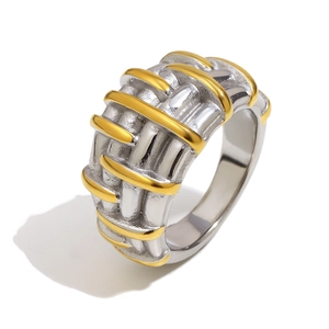 Cross-line woven ring featuring silver and 18K gold finishes in a modern wide band design