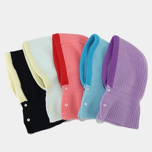 Collection of colorful knitted balaclava hats with button details for winter warmth