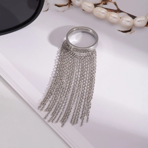 Minimalist silver chain tassel ring with fringe detail on white background and pearls