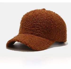 Macro view showing the thick brown teddy fleece texture of the warm winter baseball cap