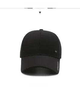 Front view detail of a black baseball cap with metallic logo and side embroidery