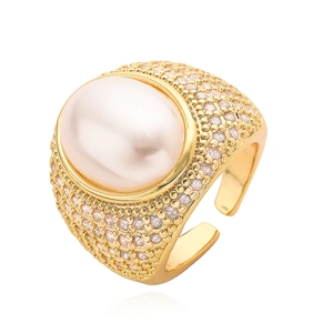 Luxurious 18K gold plated ring featuring a large oval pearl and sparkling pavé zircons