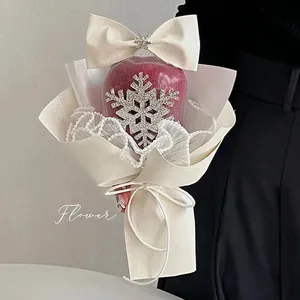 Christmas bouquet gift wrap featuring rhinestone snowflake and cream wavy texture paper
