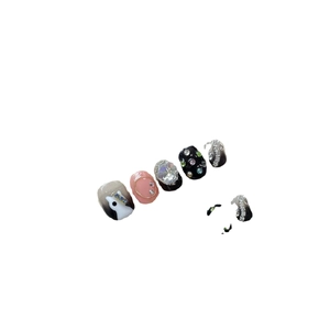 Handmade short press-on nails in elegant black and pink designs with rhinestones