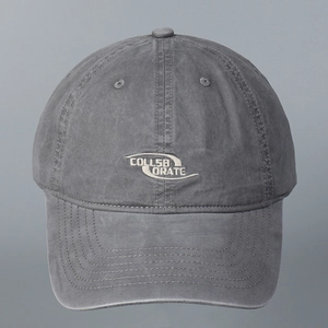 Close-up of the grey washed cotton baseball cap featuring professional embroidery detail