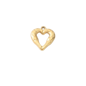 Macro shot of gold heart pendant featuring embossed texture and top hanging hole