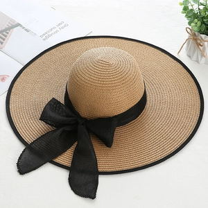 Straw sun hat with wide brim, khaki weave and large black ribbon bow for summer