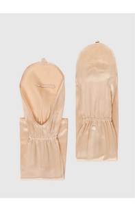 Detailed view of beige 100% mulberry silk sleeves featuring a delicate button closure