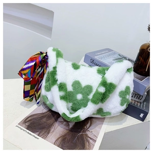 Detail of plush faux fur tote bag featuring green flower patterns and silk scarf decor
