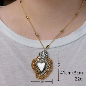 Detail view of large Sacred Heart pendant showing 5.3cm height and 4cm width measurements
