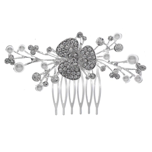 Detail of silver bridal hair comb with clear rhinestones and white pearls floral design