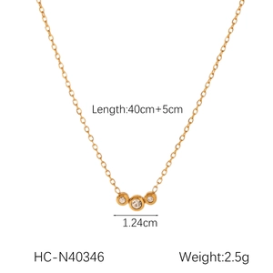 Detailed view of 18K gold geometric necklace with zircon pendants and size specifications