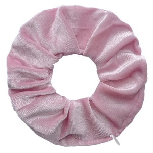 Close-up of pink tie-dye velvet scrunchie showing soft texture and elastic zipper detail