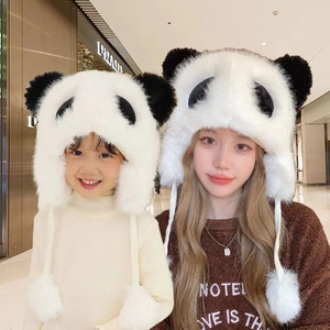 Detailed plush texture of panda-themed trapper hat with soft fur and ear flaps