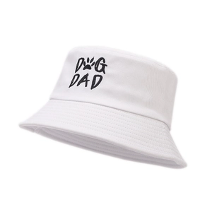 White bucket hat featuring DOG DAD embroidery and paw print on high-quality canvas fabric