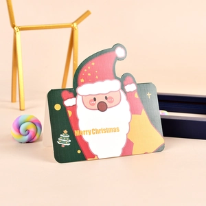 Detailed view of a 3D Santa Claus Christmas card with golden Merry Christmas text